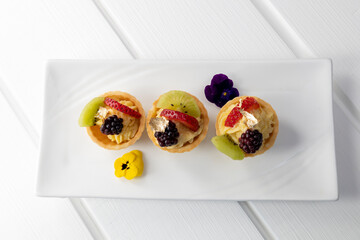 exquisite sweet sandwiches with cream and fruits, appetizers for catered event, gourmet food, lifestyle