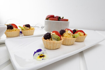 sweet dessert with fresh and organic fruits, strawberries and blackberry, cafe table and lifestyle, delicious snacks, food