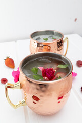 cold drink decorated with natural flowers in studio, kitchen decoration objects, textures and wallpaper, modern cup