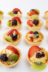 exquisite cupcakes with fruits in studio, gourmet food, pastry wallpaper, delicious appetizers of catering service