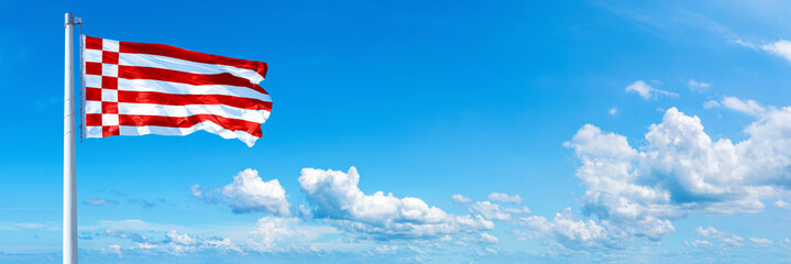 Bremen, Germany - flag waving on a blue sky in beautiful clouds - Horizontal banner
 - obrazy, fototapety, plakaty