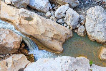 Scenic landscape with beautiful mountain brook. Idyllic scenery with clear water in small river. Fast water flow close-up