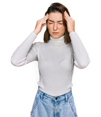 Naklejka premium Young caucasian girl wearing casual clothes with hand on head for pain in head because stress. suffering migraine.