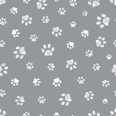 Fototapeta na wymiar Grey background with white paw prints seamless fabric design pattern