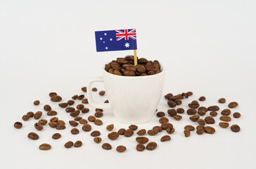 The flag of Australia sticks out of a cup of roasted coffee beans.