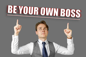 Businessman points fingers at the inscription - Be Your Own Boss