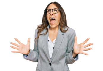 Young brunette woman wearing business clothes crazy and mad shouting and yelling with aggressive expression and arms raised. frustration concept.