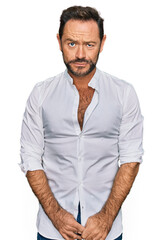 Fototapeta premium Middle age man wearing casual clothes depressed and worry for distress, crying angry and afraid. sad expression.