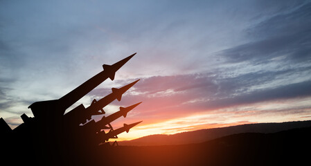 The missiles are aimed to the sky at sunset. Nuclear bomb, chemical weapons, missile defense, a...