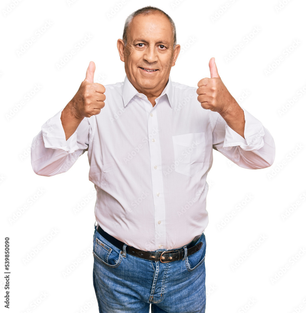 Poster Handsome senior man wearing elegant white shirt success sign doing positive gesture with hand, thumbs up smiling and happy. cheerful expression and winner gesture.