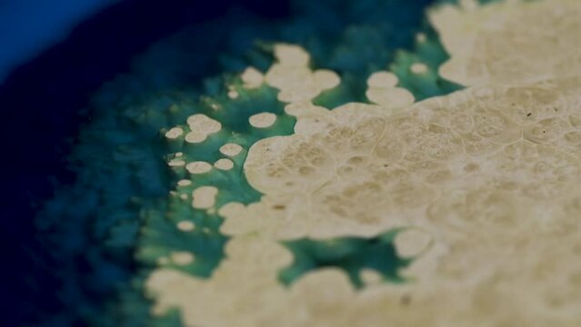 Wooden table made of natural wood and blue epoxy. Wood and epoxy resin, close up. Craft work with wood and epoxy. Handmade woodwork with modern materials and technologies. Background macro panorama