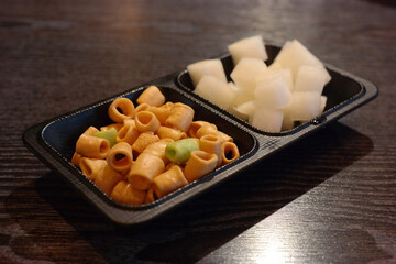 Snacks and radish pickles that are standard in Korean bars