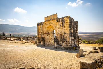 roman ruins, volubilis, morocco, triumphal arch, north africa