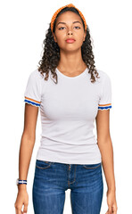 Fototapeta premium Young african american girl wearing casual clothes looking sleepy and tired, exhausted for fatigue and hangover, lazy eyes in the morning.