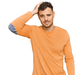 Young hispanic man wearing casual clothes confuse and wonder about question. uncertain with doubt, thinking with hand on head. pensive concept.