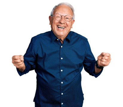 Senior man with grey hair wearing casual shirt and glasses very happy and excited doing winner gesture with arms raised, smiling and screaming for success. celebration concept.