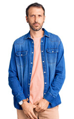 Young handsome man wearing casual clothes depressed and worry for distress, crying angry and afraid. sad expression.