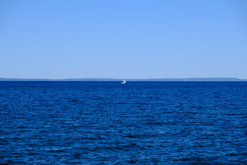 Sailboat in the distance on Lake Ontario