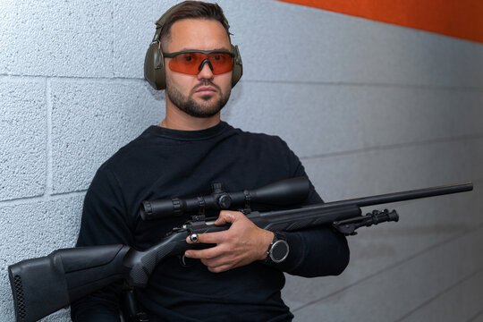 Shooter with a sniper rifle, close-up photo.