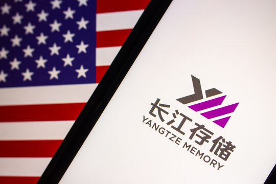 Vancouver, CANADA - Oct 19 2022 : Yangtze Memory Technologies Corp Logo On IPhone On US Flag. YMTC Is Chinese Semiconductor Integrated Device Manufacturer Specialized In Flash Memory (NAND) Chips