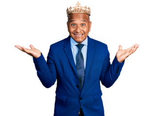 Hispanic middle age man wearing king crown celebrating victory with happy smile and winner expression with raised hands