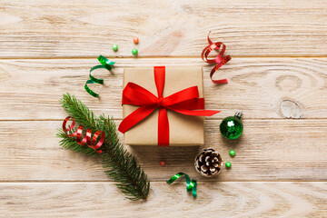 Top view Flat lay Christmas decorations and gift box on colored background with copy space. Christmas or Happy New Year composition