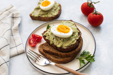 Healhy Breakfast Toast With Avocado, Boiled Egg On Plate