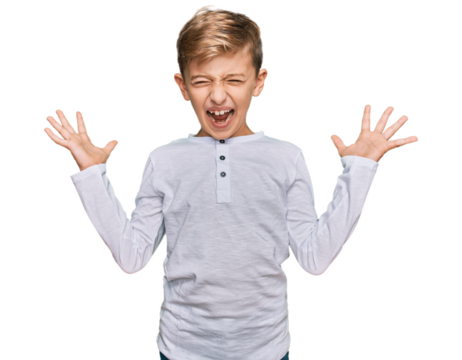 Little caucasian boy kid wearing casual clothes celebrating mad and crazy for success with arms raised and closed eyes screaming excited. winner concept - Powered by Adobe
