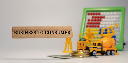 Business to Consumer written on wooden surface. Economy and markets.