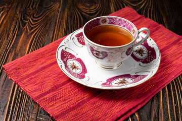 ceramic cup of tea on wooden table.