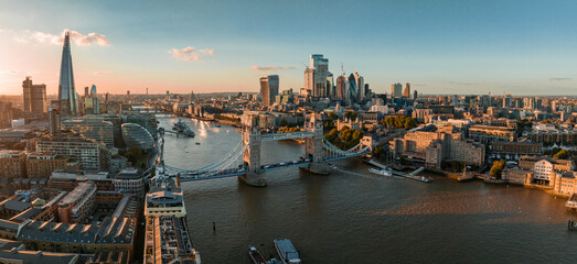 Fototapeta na wymiar Aerial view of the London Tower Bridge at sunset. Sunset with beautiful clouds over London - the capital of Britain.