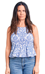 Obraz premium Young beautiful brunette woman wearing casual t-shirt depressed and worry for distress, crying angry and afraid. sad expression.