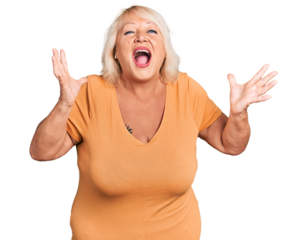 Middle age blonde woman wearing casual clothes crazy and mad shouting and yelling with aggressive expression and arms raised. frustration concept.