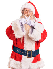 Old senior man with grey hair and long beard wearing traditional santa claus costume rejection expression crossing fingers doing negative sign