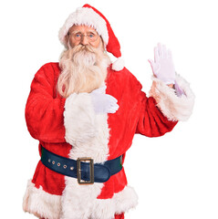 Old senior man with grey hair and long beard wearing traditional santa claus costume swearing with hand on chest and open palm, making a loyalty promise oath