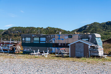 An old dilapidated mobile home used as a cabin