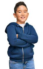 Little boy hispanic kid wearing casual sporty jacket happy face smiling with crossed arms looking at the camera. positive person. © Krakenimages.com