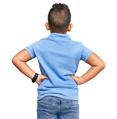 Little boy hispanic kid wearing casual clothes standing backwards looking away with arms on body © Krakenimages.com