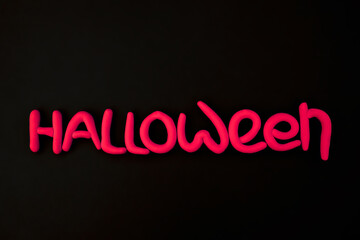halloween red inscription, text from air plasticine on black background