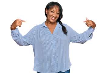 Hispanic middle age woman wearing casual clothes looking confident with smile on face, pointing oneself with fingers proud and happy.