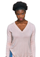 Young african american girl wearing casual clothes skeptic and nervous, frowning upset because of problem. negative person.
