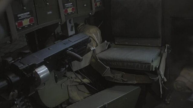 This video shows the inside of a military gunner compartment plane.
