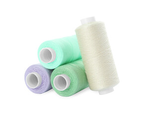 Different colorful sewing threads on white background