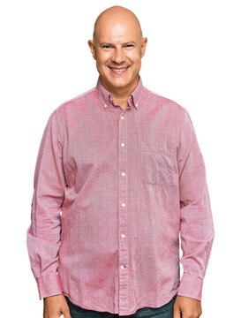 Middle age bald man wearing casual clothes with a happy and cool smile on face. lucky person.