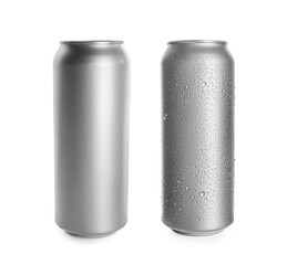 Aluminum drink cans, one with water drops on white background