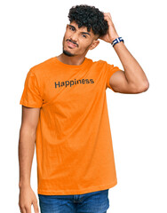 Young arab man wearing tshirt with happiness word message confuse and wondering about question....