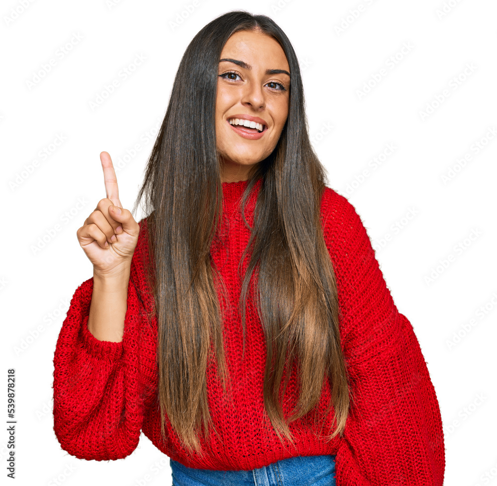 Canvas Prints Beautiful hispanic woman wearing casual clothes pointing finger up with successful idea. exited and happy. number one.