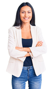 Young beautiful latin girl wearing business clothes happy face smiling with crossed arms looking at the camera. positive person.