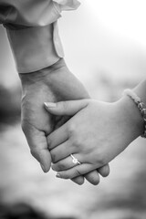 bride and groom holding hands