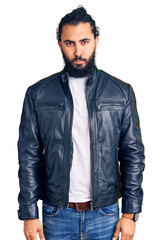 Young arab man wearing casual leather jacket depressed and worry for distress, crying angry and afraid. sad expression.